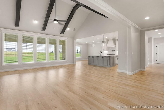 223 W 172nd St S, Mounds, OK 74047 - unfurnished living room with ceiling fan, beamed ceiling, recessed lighting, light wood-type flooring, and high vaulted ceiling