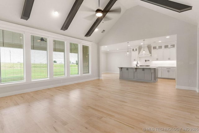 223 W 172nd St S, Mounds, OK 74047 - unfurnished living room with high vaulted ceiling, healthy amount of natural light, ceiling fan, light wood-style flooring, and recessed lighting