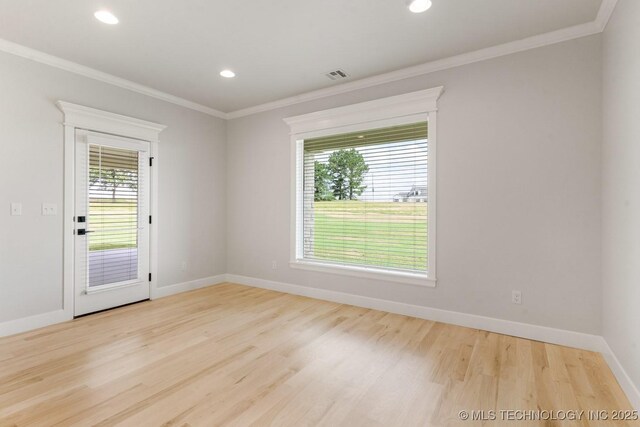 223 W 172nd St S, Mounds, OK 74047 - unfurnished room with wood finished floors, healthy amount of natural light, ornamental molding, and recessed lighting