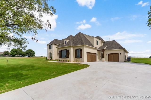 223 W 172nd St S, Mounds, OK 74047 - french country home featuring stucco siding, a garage, a front yard, and concrete driveway