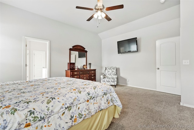 bedroom featuring ceiling fan, vaulted ceiling, and carpet