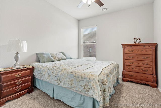 bedroom with light colored carpet and ceiling fan