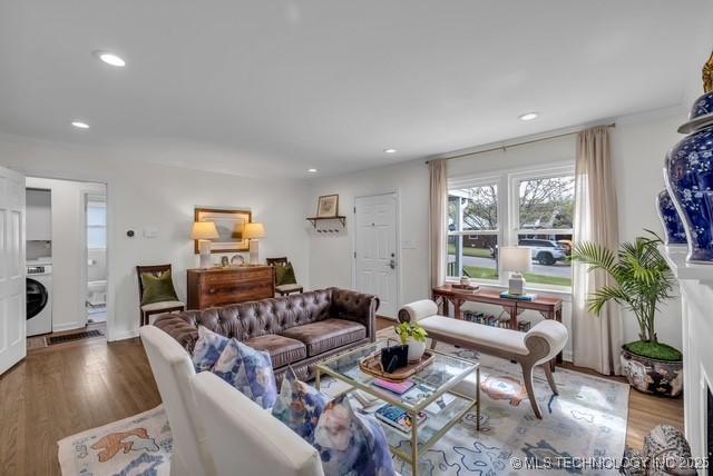 living room featuring washer / clothes dryer and hardwood / wood-style flooring