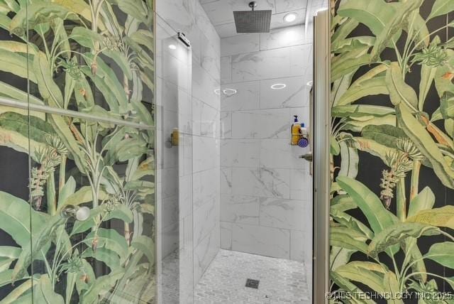 bathroom with a tile shower