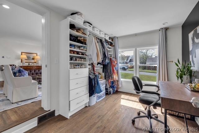 office space with wood-type flooring