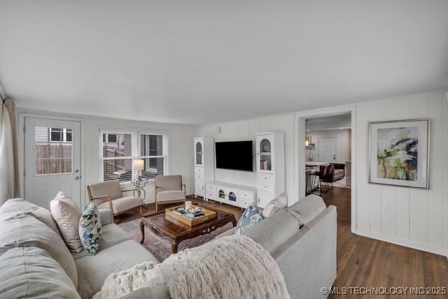 living room with dark hardwood / wood-style flooring