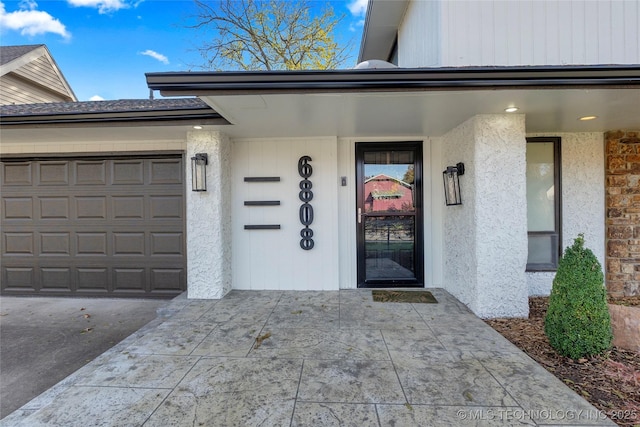 entrance to property featuring a garage