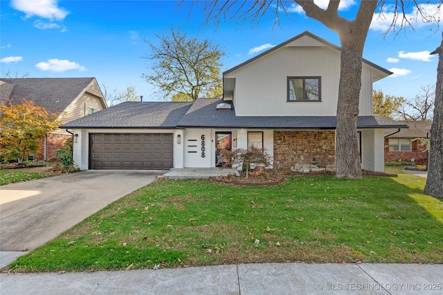 view of front facade with a front lawn and a garage