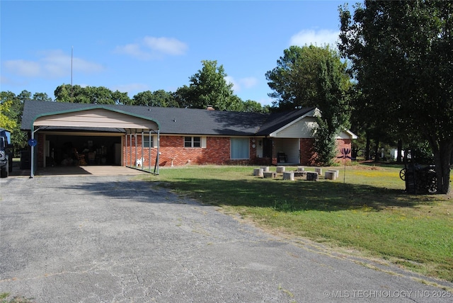 ranch-style home with a front lawn and a garage