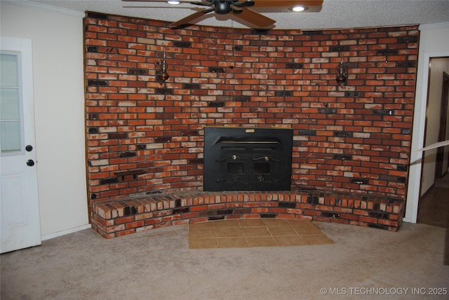 details with ornamental molding, a wood stove, a textured ceiling, and carpet flooring