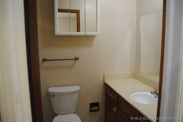 bathroom with toilet and vanity