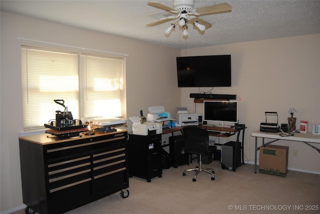 office space featuring ceiling fan and light carpet