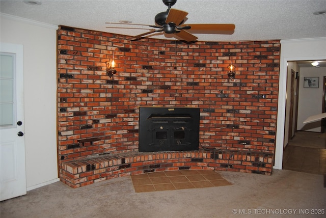 details featuring a textured ceiling, crown molding, a wood stove, and carpet