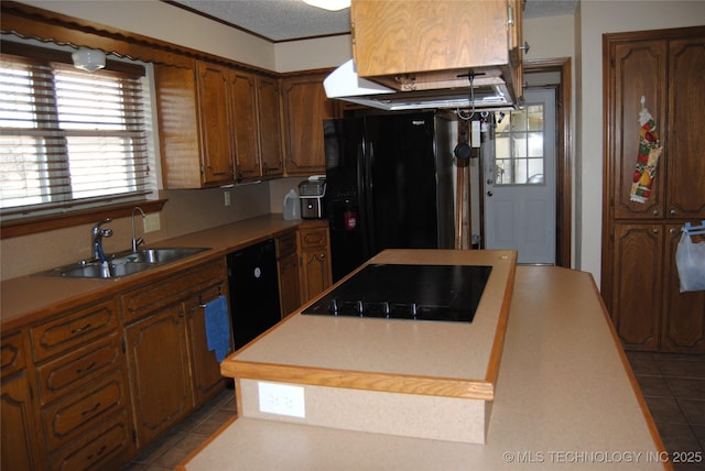 kitchen with sink, light tile patterned floors, and black appliances