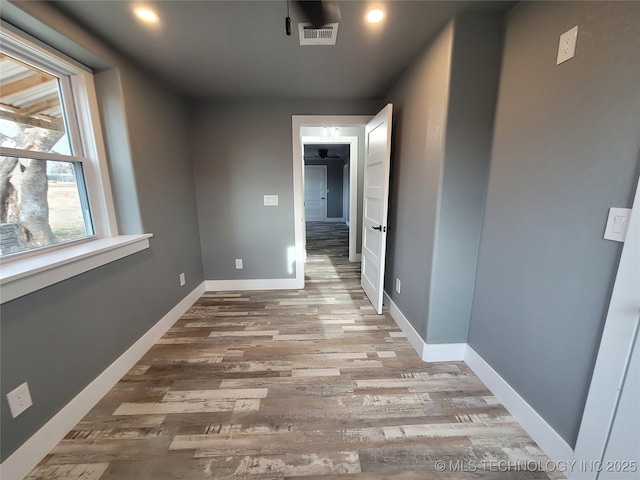 hall with wood-type flooring