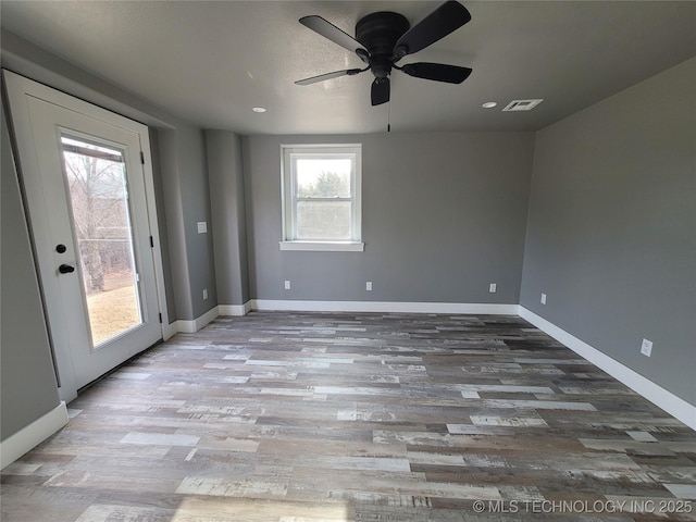 unfurnished room featuring ceiling fan and light hardwood / wood-style flooring