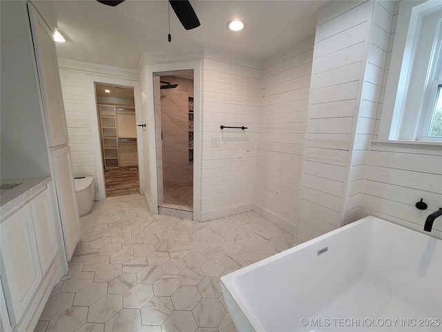 bathroom with ceiling fan, sink, and independent shower and bath