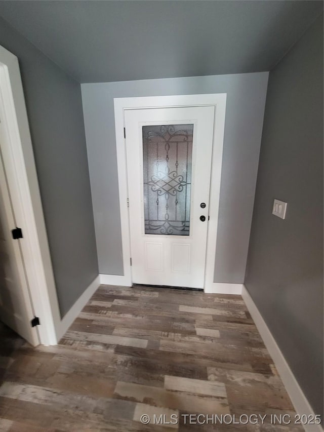 foyer entrance with dark wood-type flooring