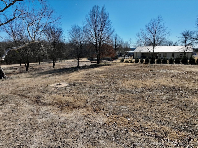 view of yard with a rural view