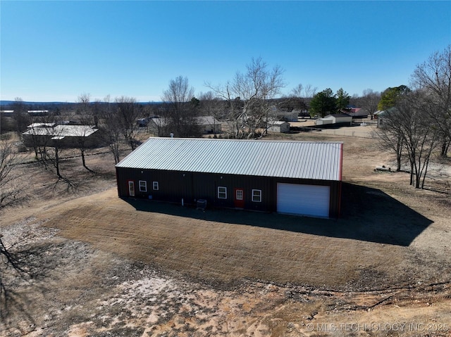 exterior space featuring an outbuilding and a garage