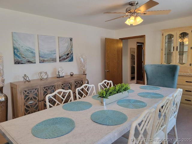 dining space featuring ceiling fan