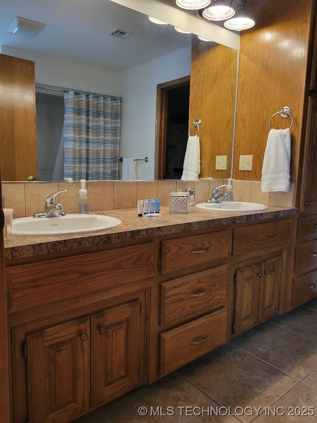 bathroom featuring tile patterned floors and vanity