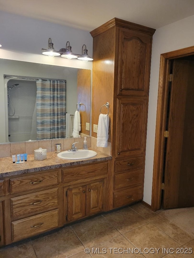 bathroom with tile patterned flooring and vanity