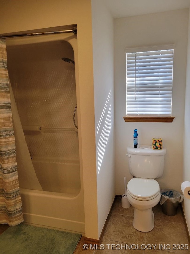 bathroom featuring toilet, tile patterned flooring, and shower / tub combo