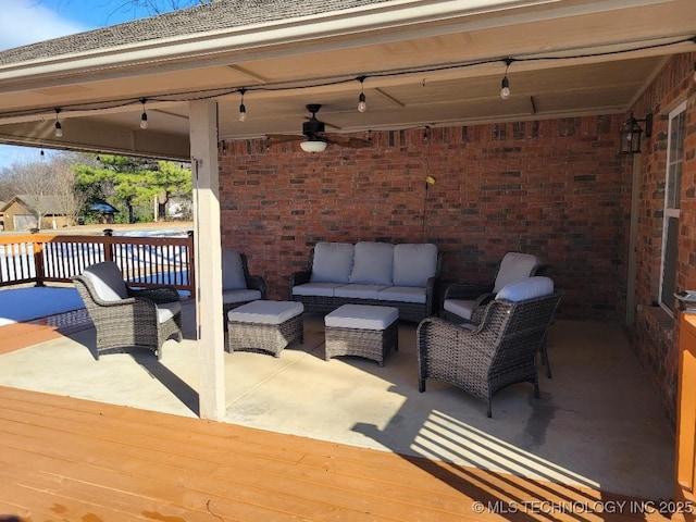 view of patio / terrace with ceiling fan, an outdoor hangout area, and a deck