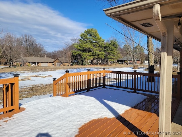 view of snow covered deck