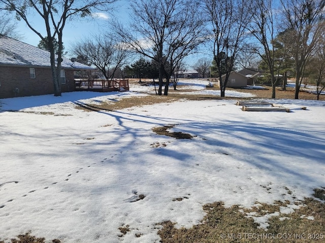 view of yard covered in snow