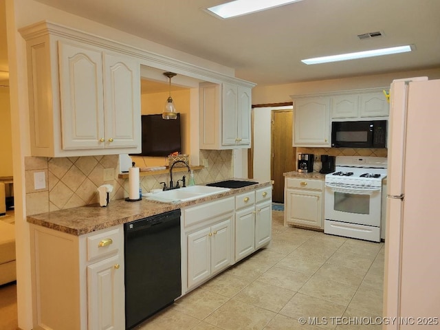 kitchen with black appliances, tasteful backsplash, decorative light fixtures, and sink