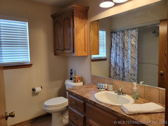 bathroom featuring a shower with curtain, decorative backsplash, vanity, and toilet