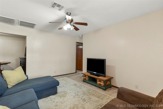 living room with ceiling fan and light carpet