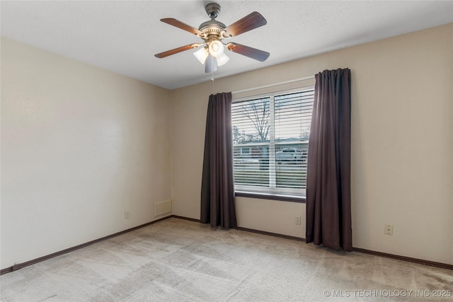 carpeted empty room with ceiling fan