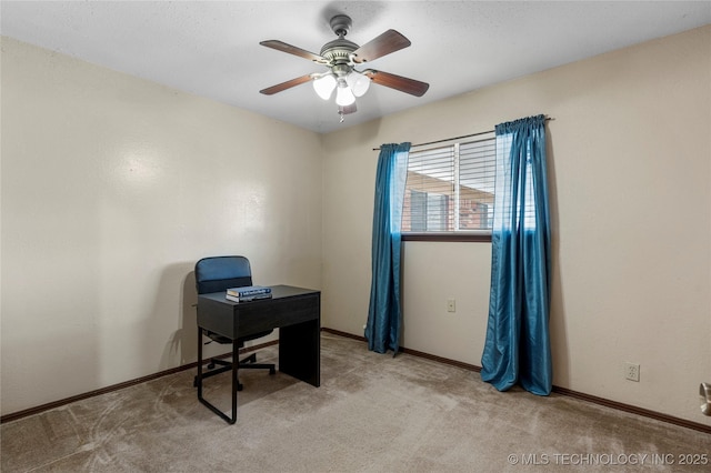 carpeted office space with ceiling fan