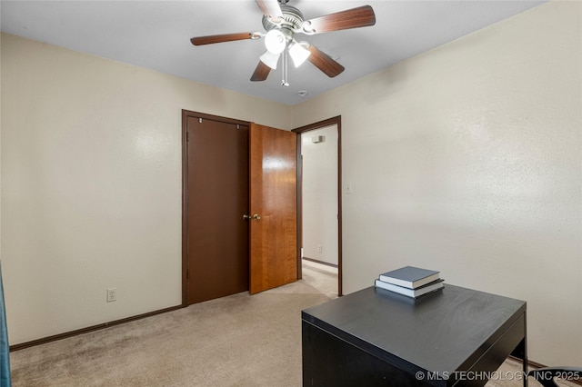 office featuring light colored carpet and ceiling fan