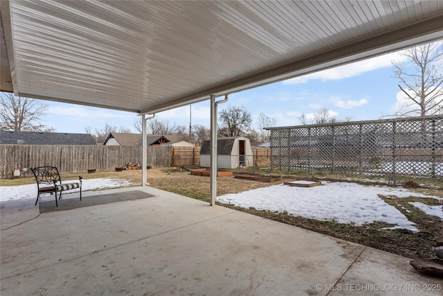 view of patio featuring a storage unit