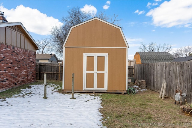 snow covered structure featuring a yard