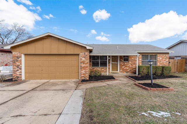 ranch-style home with a front lawn and a garage