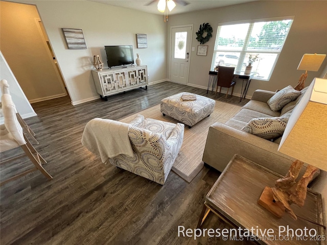 living room featuring dark hardwood / wood-style flooring and ceiling fan