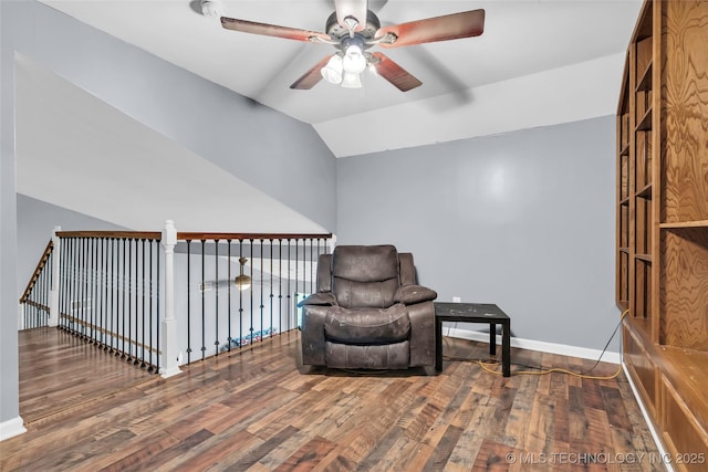 sitting room with lofted ceiling, hardwood / wood-style floors, and ceiling fan