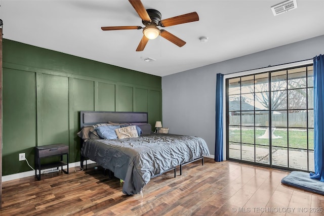 bedroom featuring ceiling fan and dark wood-type flooring