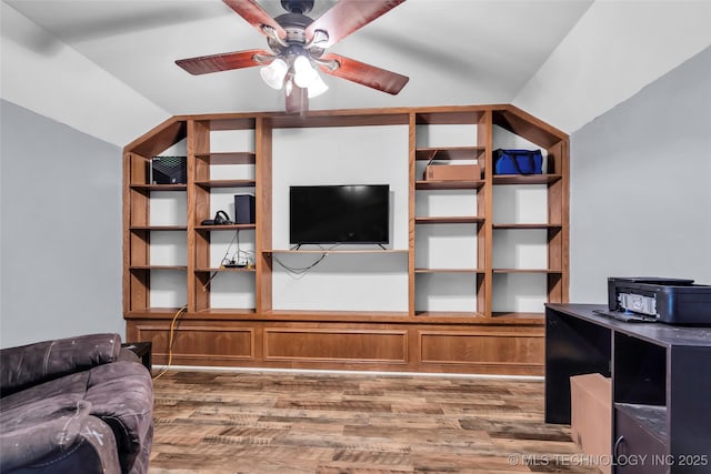 living room featuring ceiling fan, vaulted ceiling, and hardwood / wood-style flooring