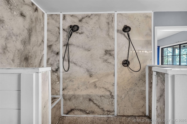 bathroom with a tile shower