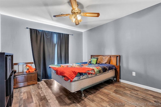 bedroom with ceiling fan and hardwood / wood-style floors