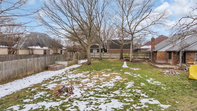 view of yard covered in snow