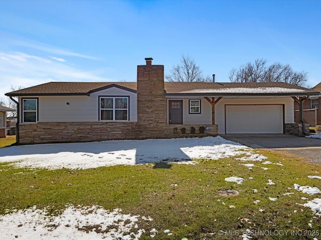 single story home with a yard and a garage