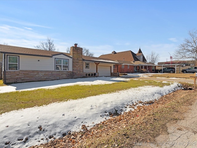 single story home featuring a garage