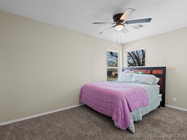 bedroom featuring ceiling fan and carpet